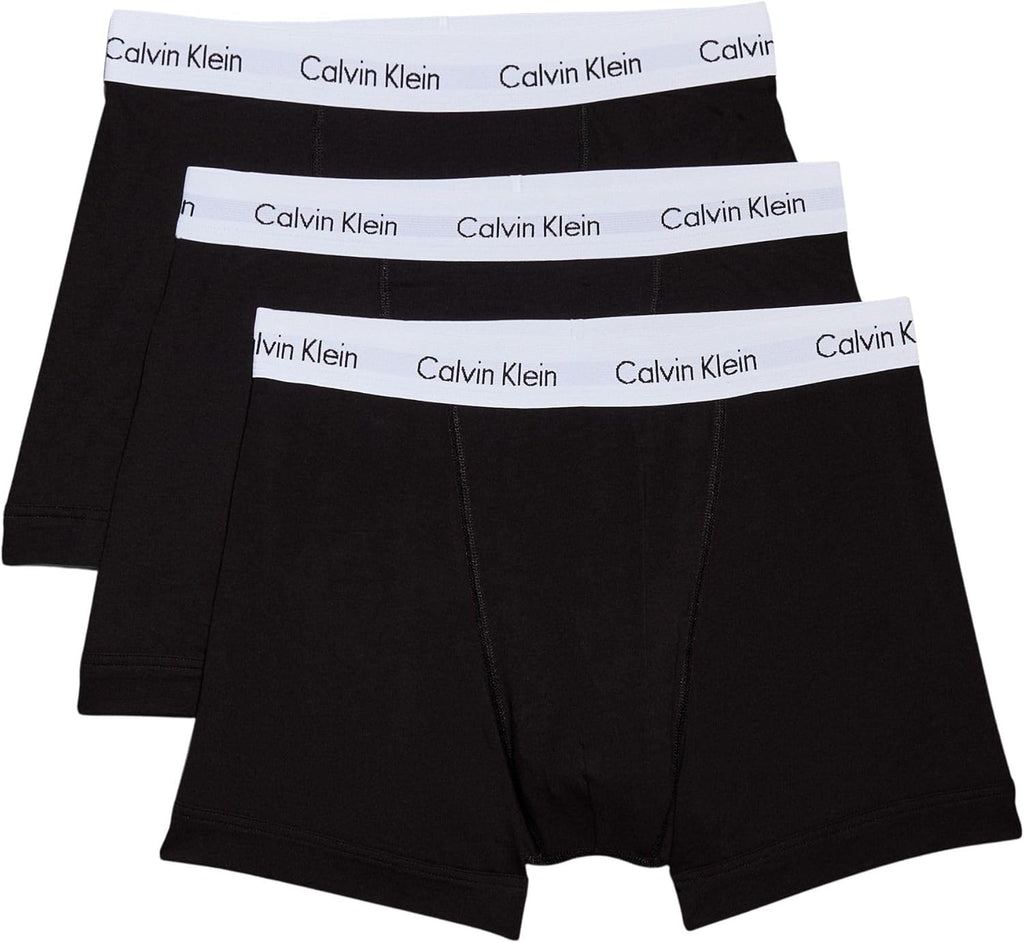 Tris di boxer Calvin Klein uomo in cotone nero, grigio e bianco con elastico logato in vita.